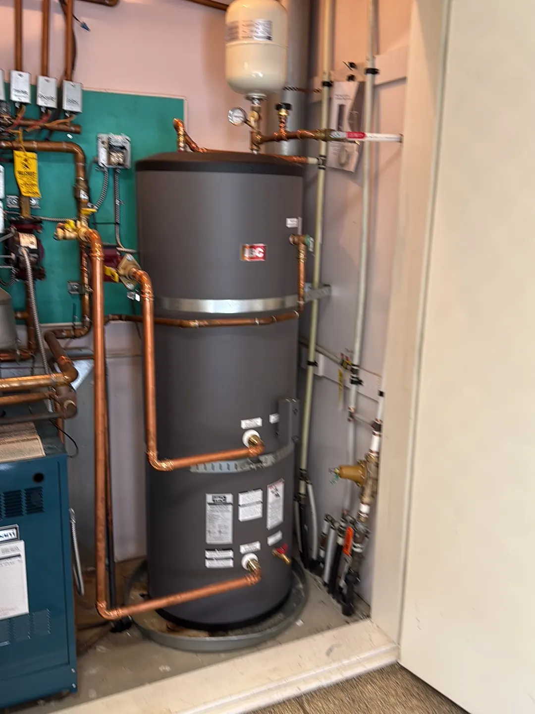 Indirect hot water tank piped to a boiler with new copper lines